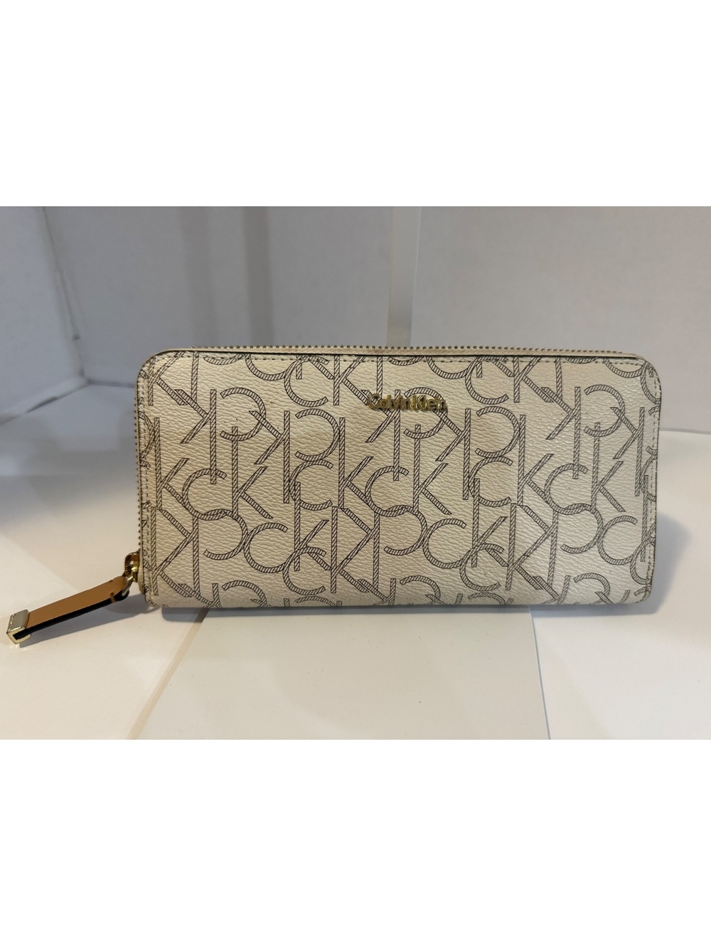 Calvin Klein cream monogram zip around wallet